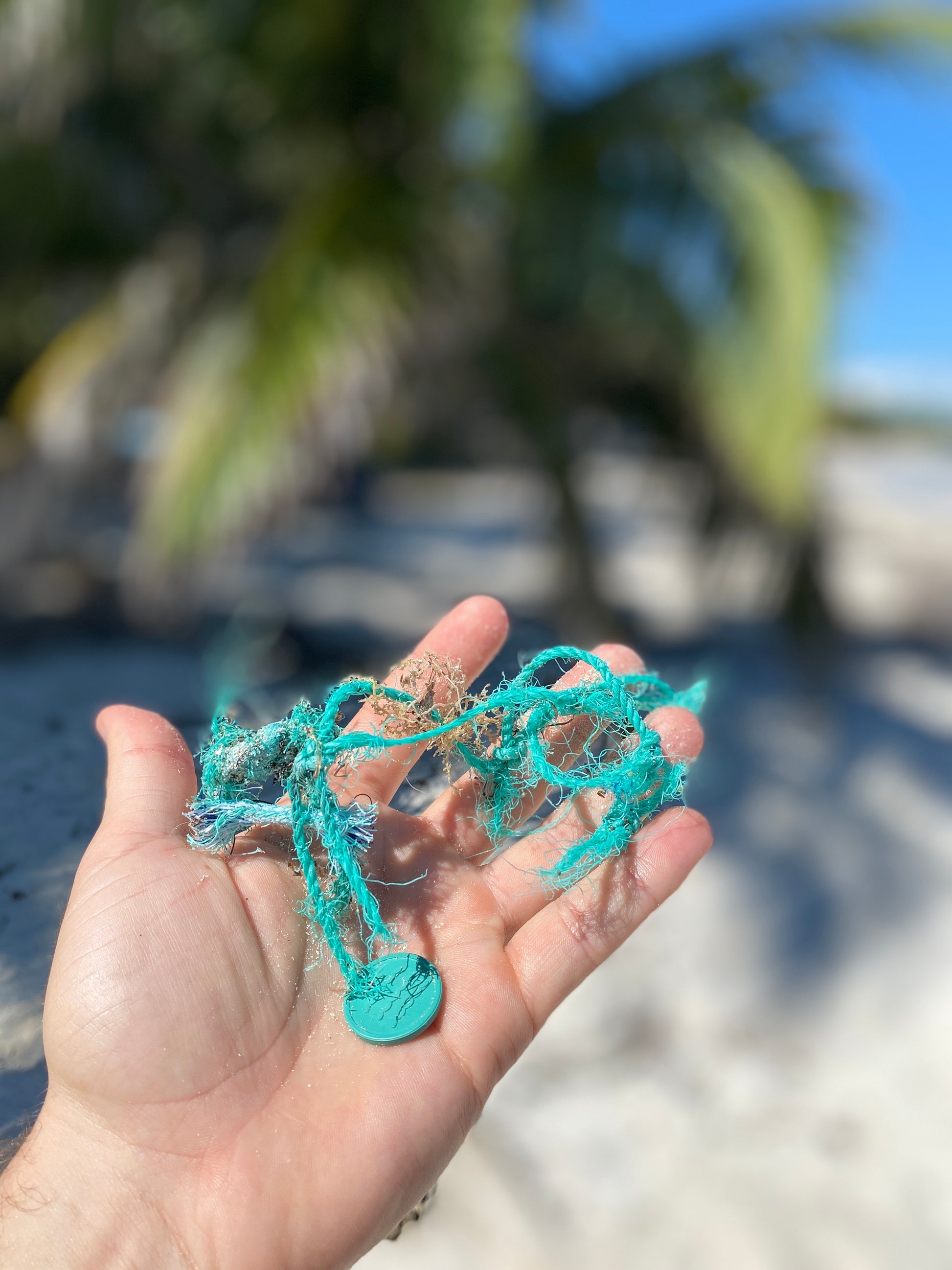 A photo of Recycled Ocean Plastic Tokens from JM Band®. Purchase Tokens in 35 mm here.