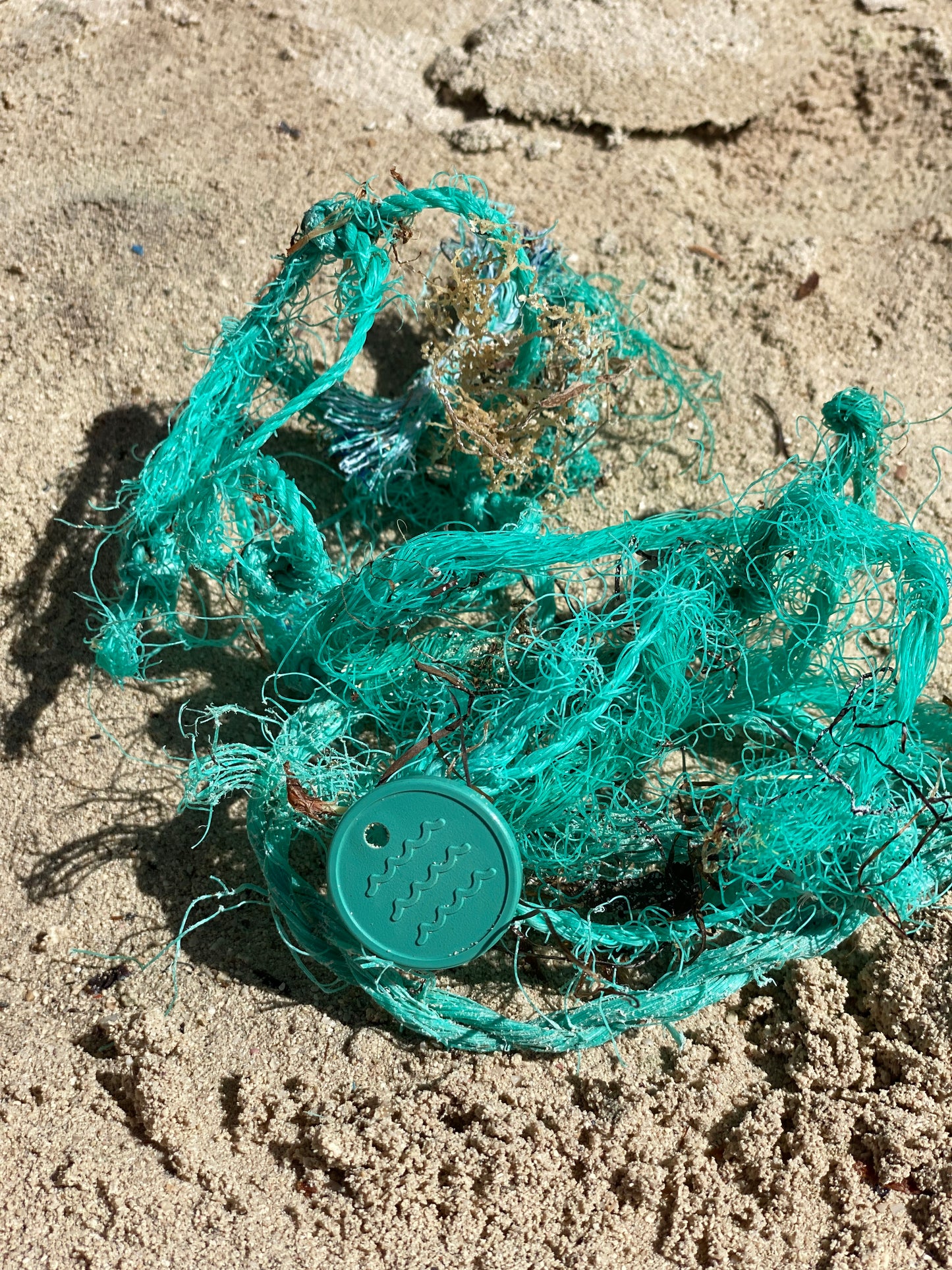 A photo of Recycled Ocean Plastic Tokens from JM Band®. Purchase Tokens in 25 mm here.