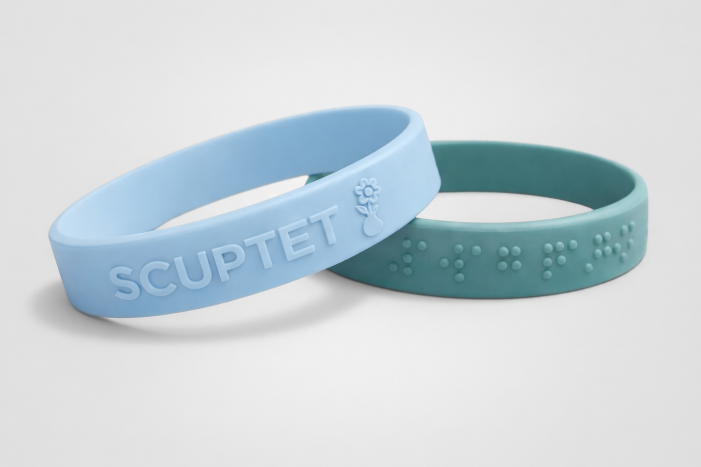 Bracelets en silicone gaufré avec texte en relief de JM Band®.